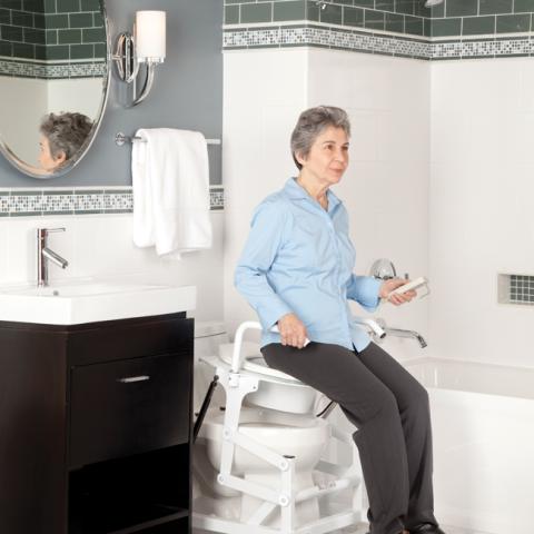 elderly woman using toilet lift