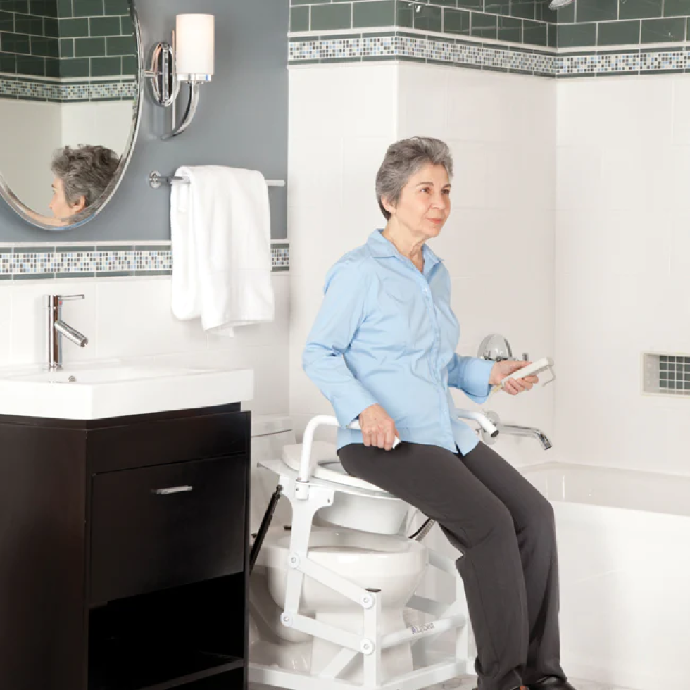 woman sitting on liftseat toilet lift