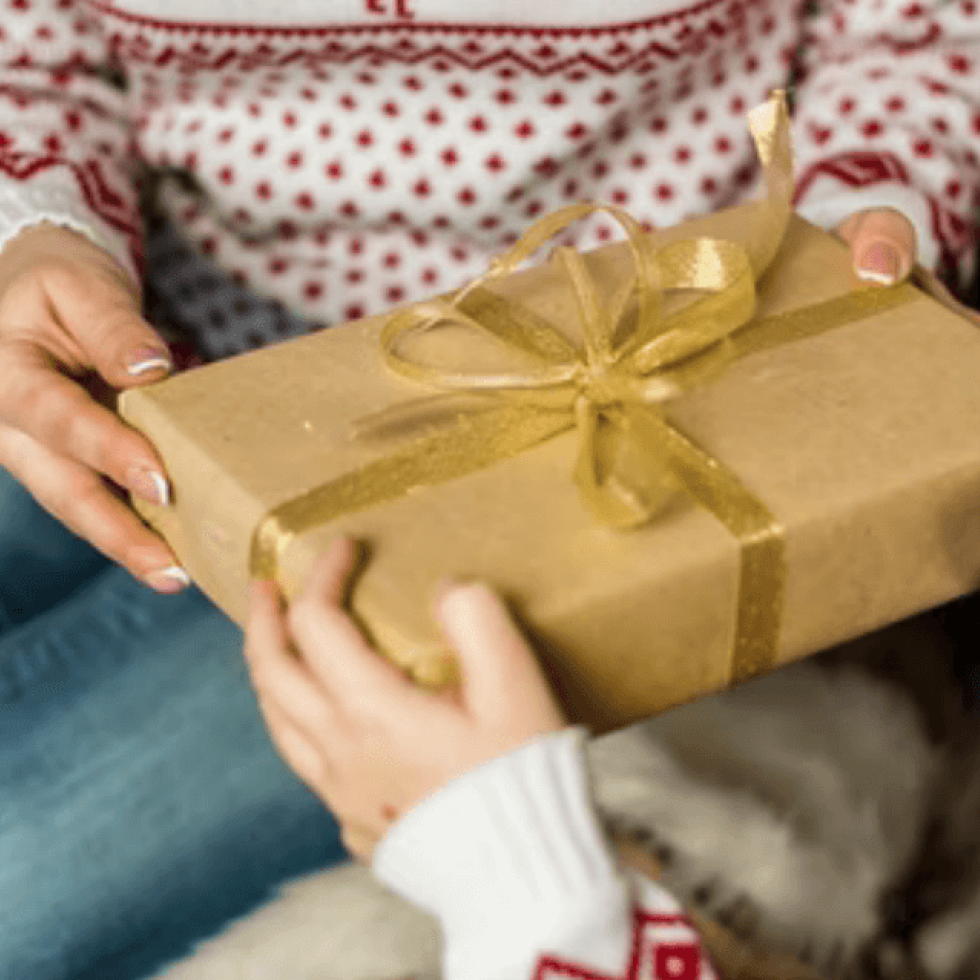 two people exchanging a gift