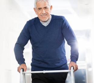 person walking with a walker device